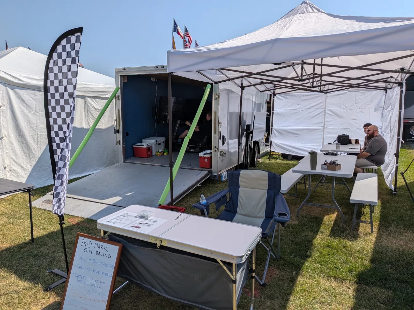 Skid Mark's trailer and tent setup at an outdoor event